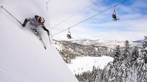 A skier on a powder day in December off of the Far East chairlift at Palisades.
