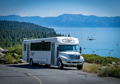Charter bus for 42 people stopped at a Lake Tahoe viewpoint