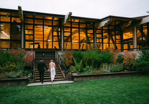 A couple walking into OVEC, one of Palisades Tahoe's wedding venues
