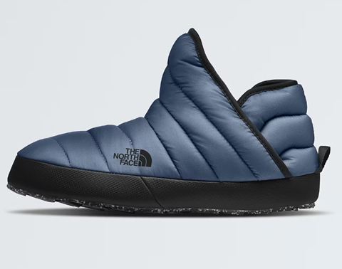 A pair of navy blue North Face slip-on winter booties. 
