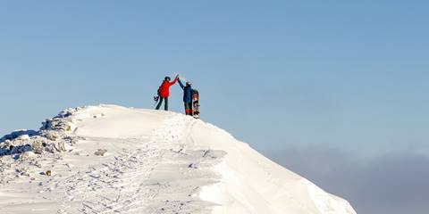skiers high fiving