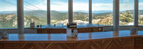 Views from the Terrace Bar at Palisades Tahoe's High Camp overlooking the Sierra mountains and Lake Tahoe