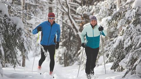 Two cross country skiers tackle the course in Olympic Valley.
