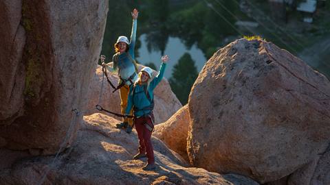 Two women climbing on the Tahoe Via Ferrata in Olympic Valley