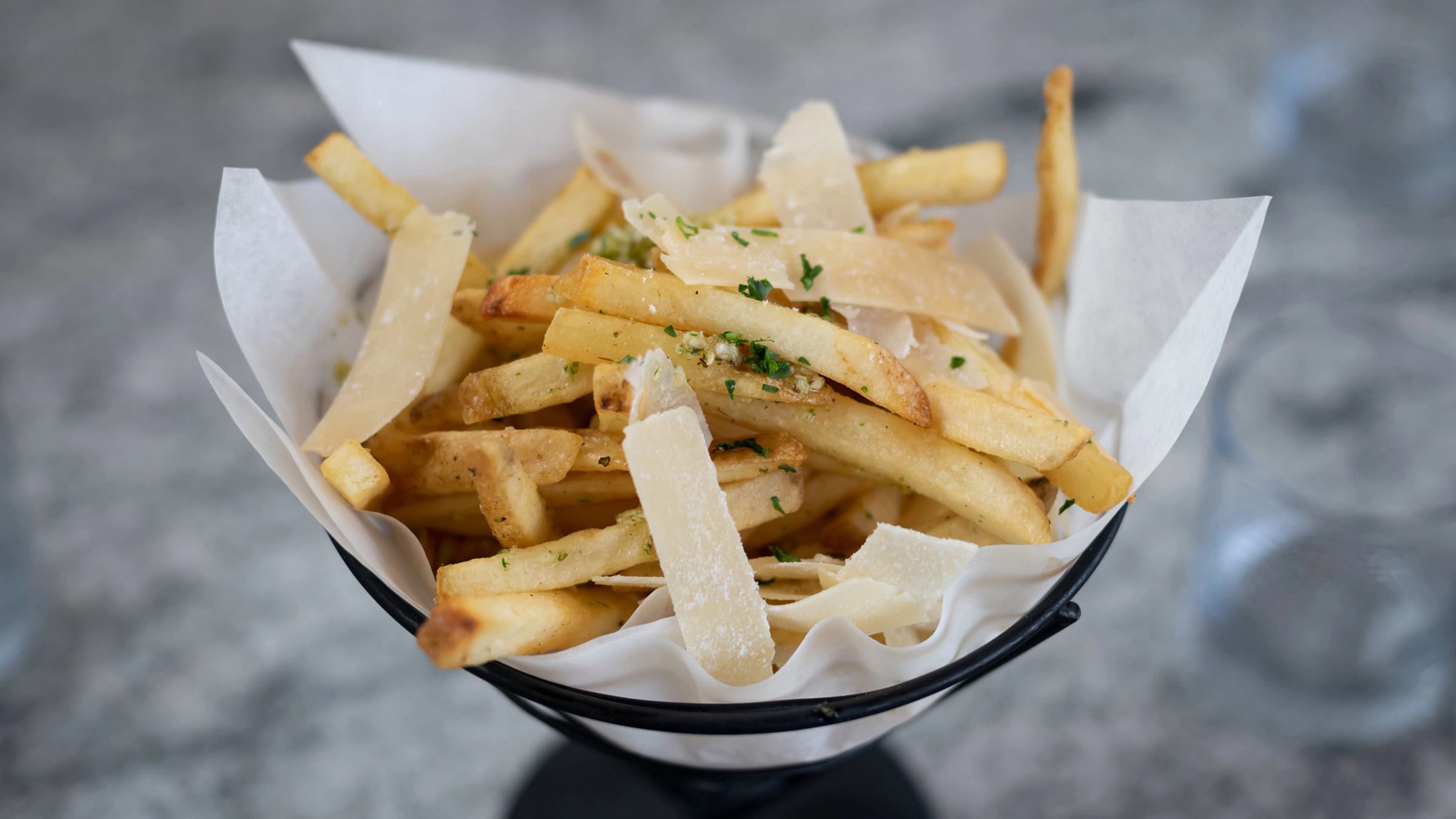 Basket of French Fries served at Granite Bistro, located mountaintop at Palisades Tahoe's High Camp