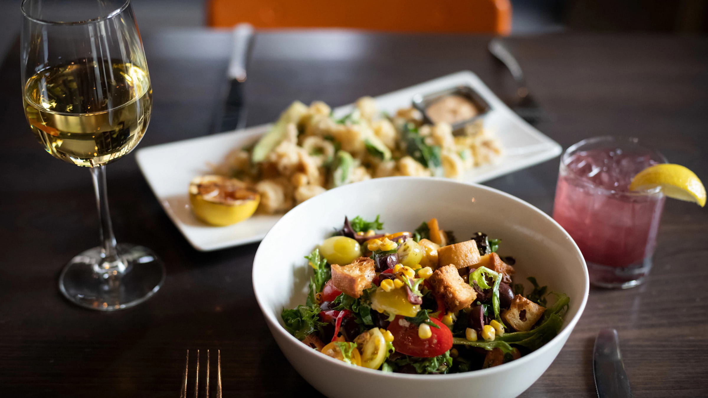 Panzanella dish at Rocker at Palisades Tahoe. Served with heirloom cherry tomatoes, kalamata olives, sliced fresno peppers, grilled corn, basil, warm house made croutons, red wine vinaigrette