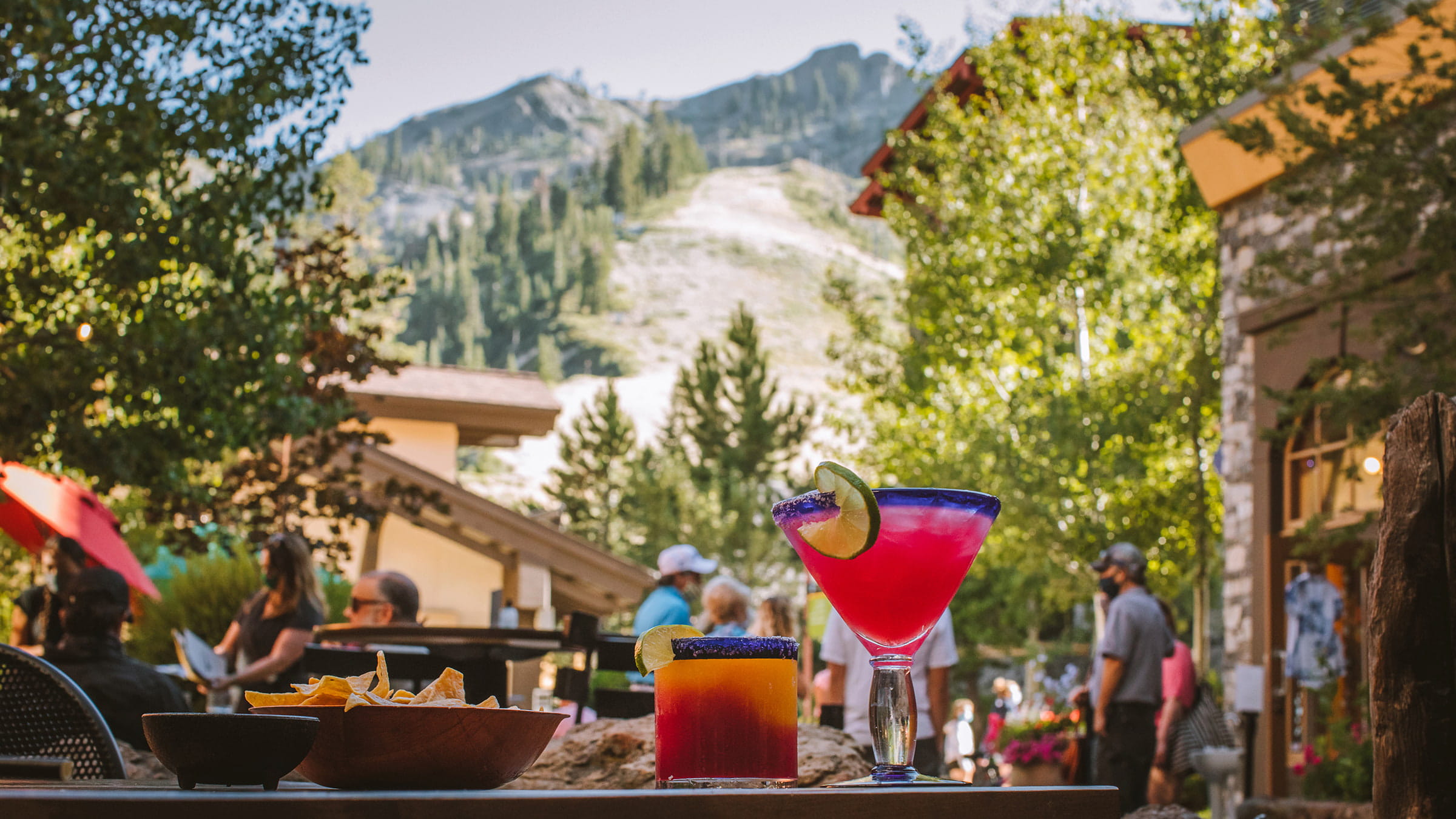 Outdoor table with cocktails at Tremigo Mexican Kitchen & Tequila Bar in the Village at Palisades Tahoe in summer