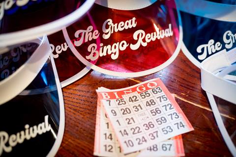 Bingo visors and Bingo cards are displayed on a table at The Great Bingo Revival at the Village at Palisades Tahoe. 