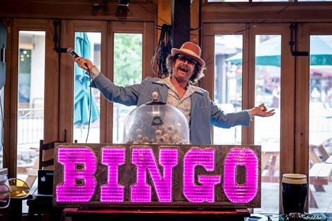Rusty Ream calls Bingo at The Great Bingo Revival in the Village at Palisades Tahoe. 