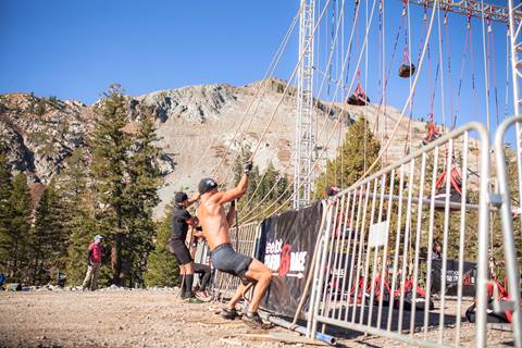 Competitors participate in an obstacle challenge at a Spartan Race in Olympic Valley, California. 