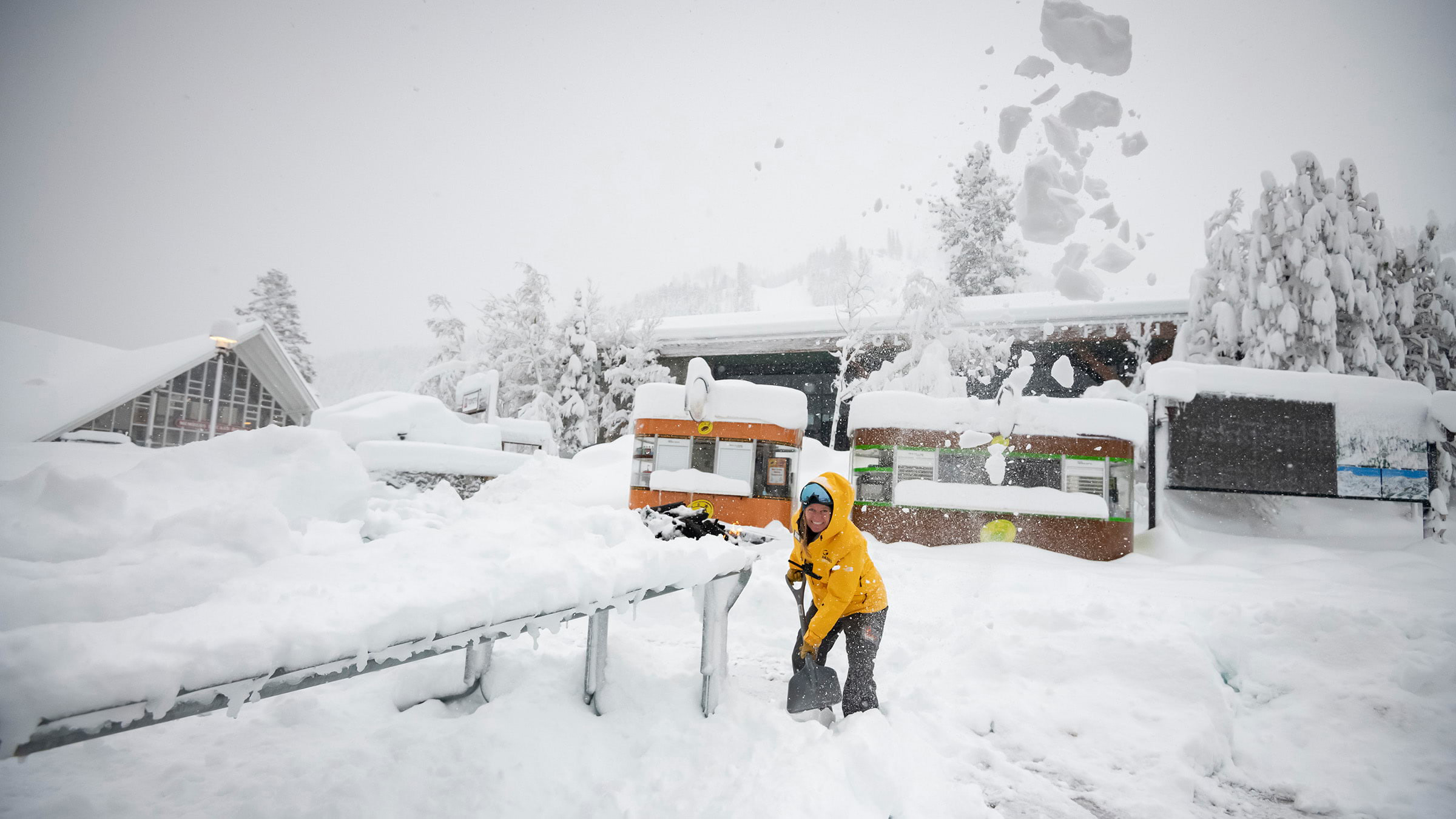 Palisades Tahoe Mountain Host shoveling snow during at 5+ foot storm in December 2021