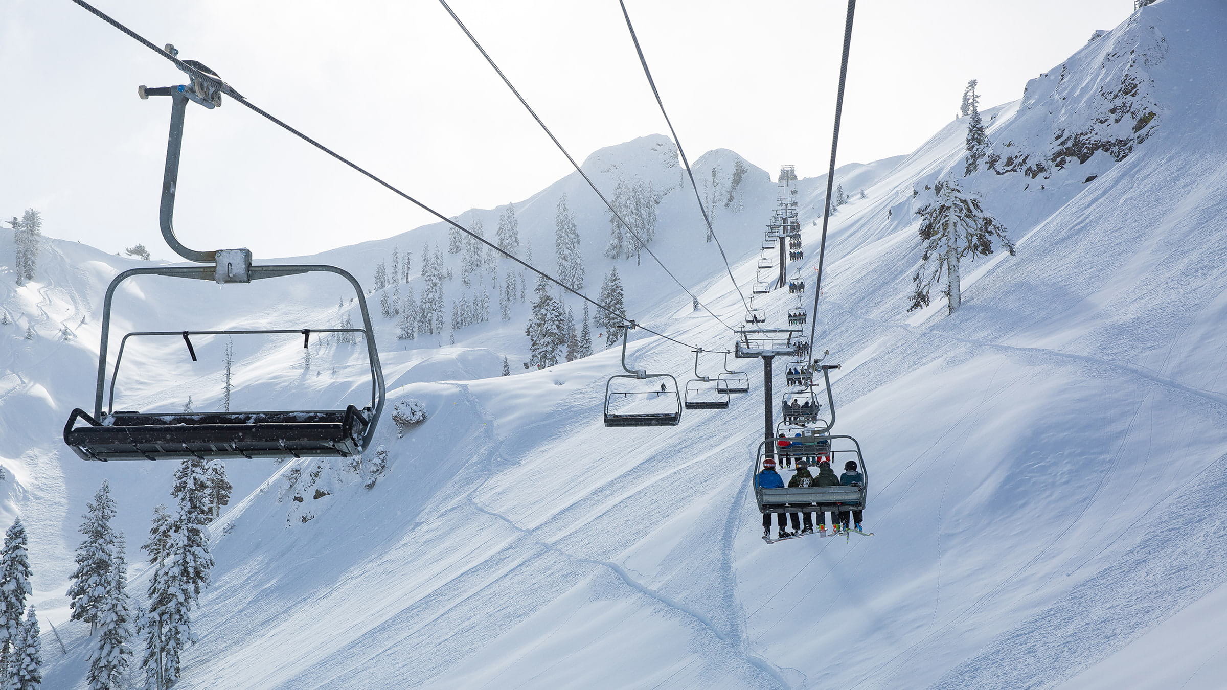 Skiers ride the legendary KT-22 lift at Palisades.