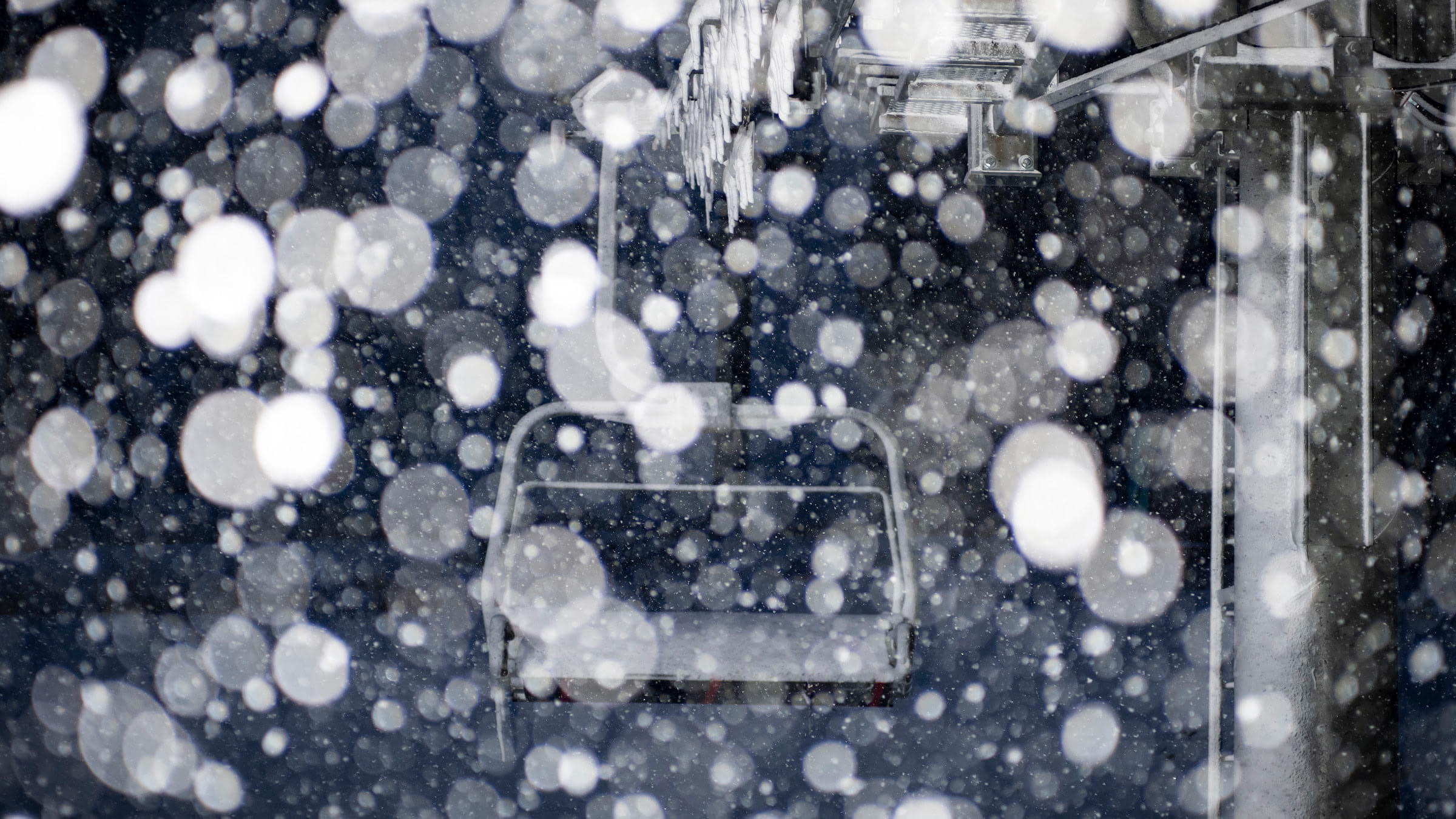 Heavy Snowfall in front on a chairlift at Palisades Tahoe