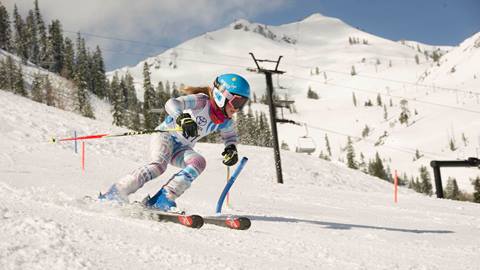 A skier for the U12-U21 Far West FIS Full Time team skis at Olympic Valley
