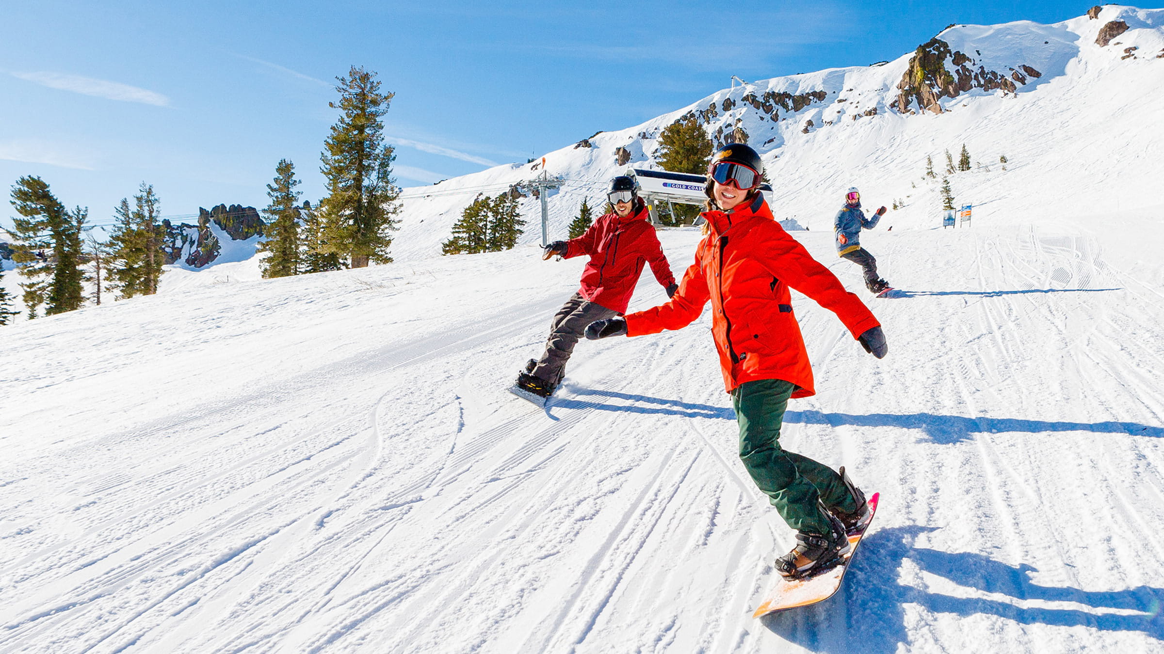 Snowboarders at Palisades Tahoe in spring