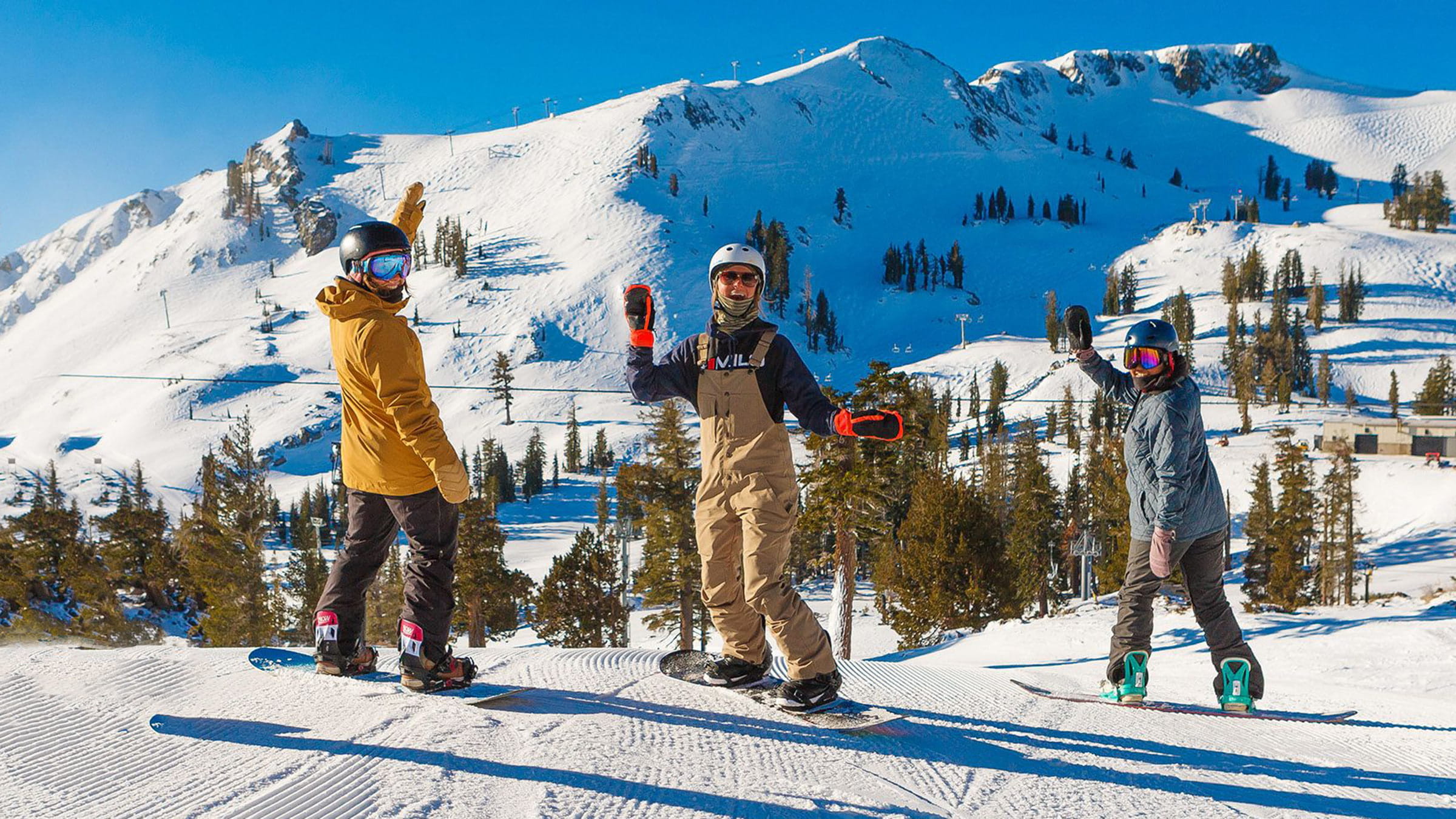 Three snowboarders at Palisades Tahoe in Spring