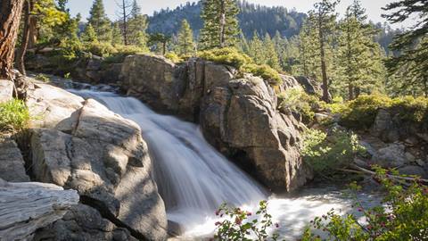 Scenic image of a flowing waterfall on the Shirley Canyon trail in Olympic Valley, CA