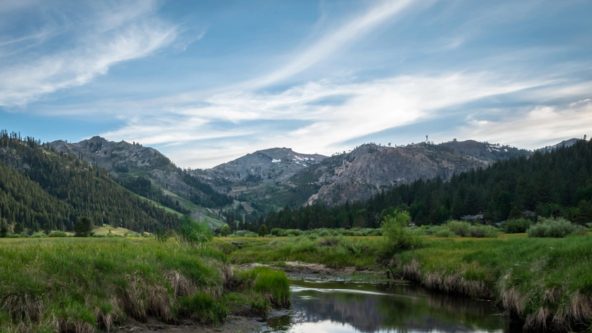 Valley view from a trail in between Resort at Squaw Creek and The Village at Palisades Tahoe