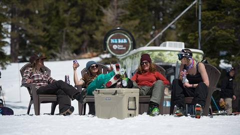 A group of women enjoy an on-mountain beer at Alpine Meadows' Ice Bar.