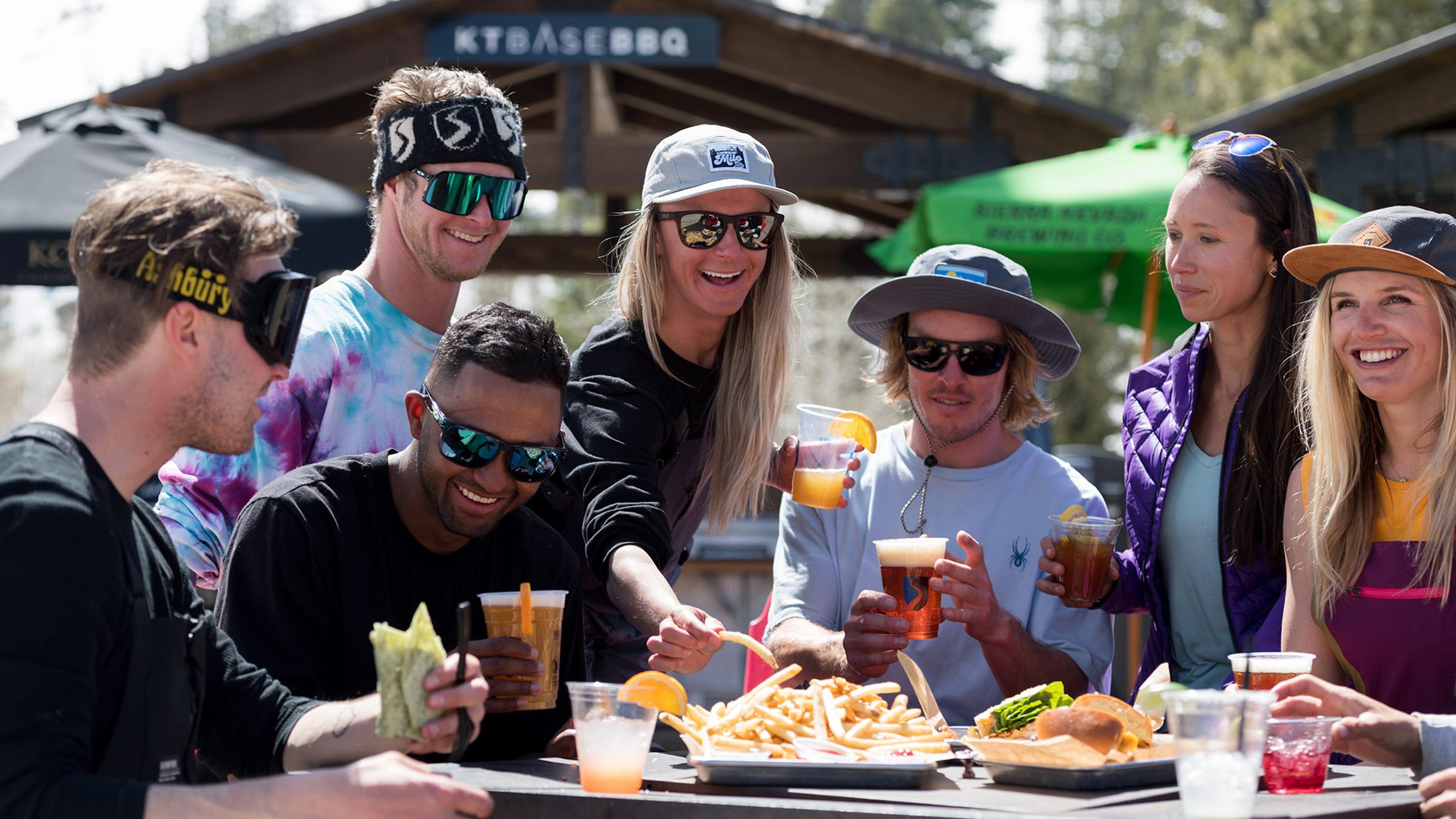 Squaw Valley athletes enjoy beers and food at KT Base Bar on a spring day.