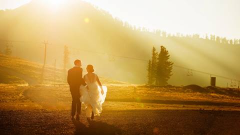 Bride and Groom walking into the sunset at Squaw Valley