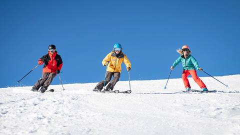 Mountain Host guided ski & ride service skiing on mountain