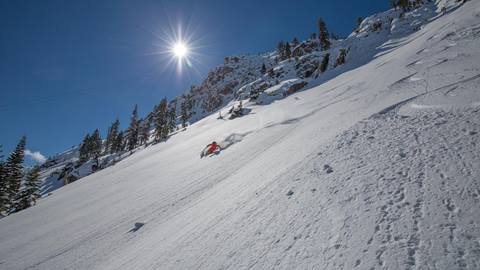 Alpenglow Expeditions guide Dave Nettle enjoying cold powder on a guided tour at Squaw Valley