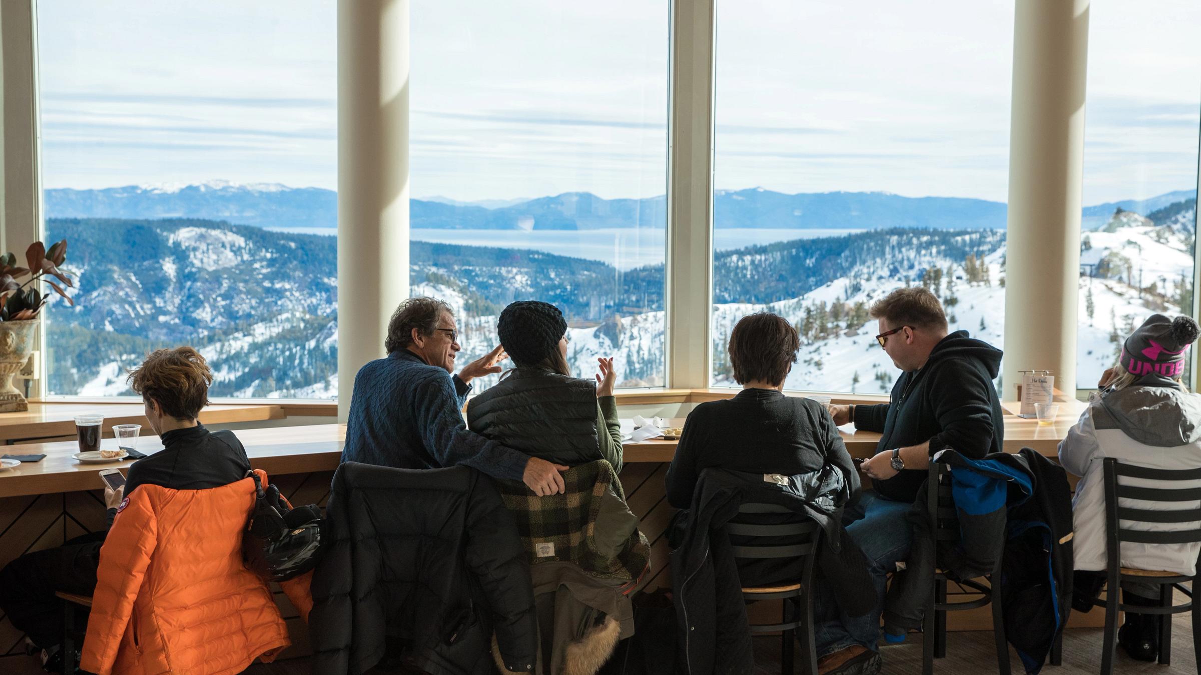 People enjoying drinks in the front of the panoramic views at the Terrace Bar