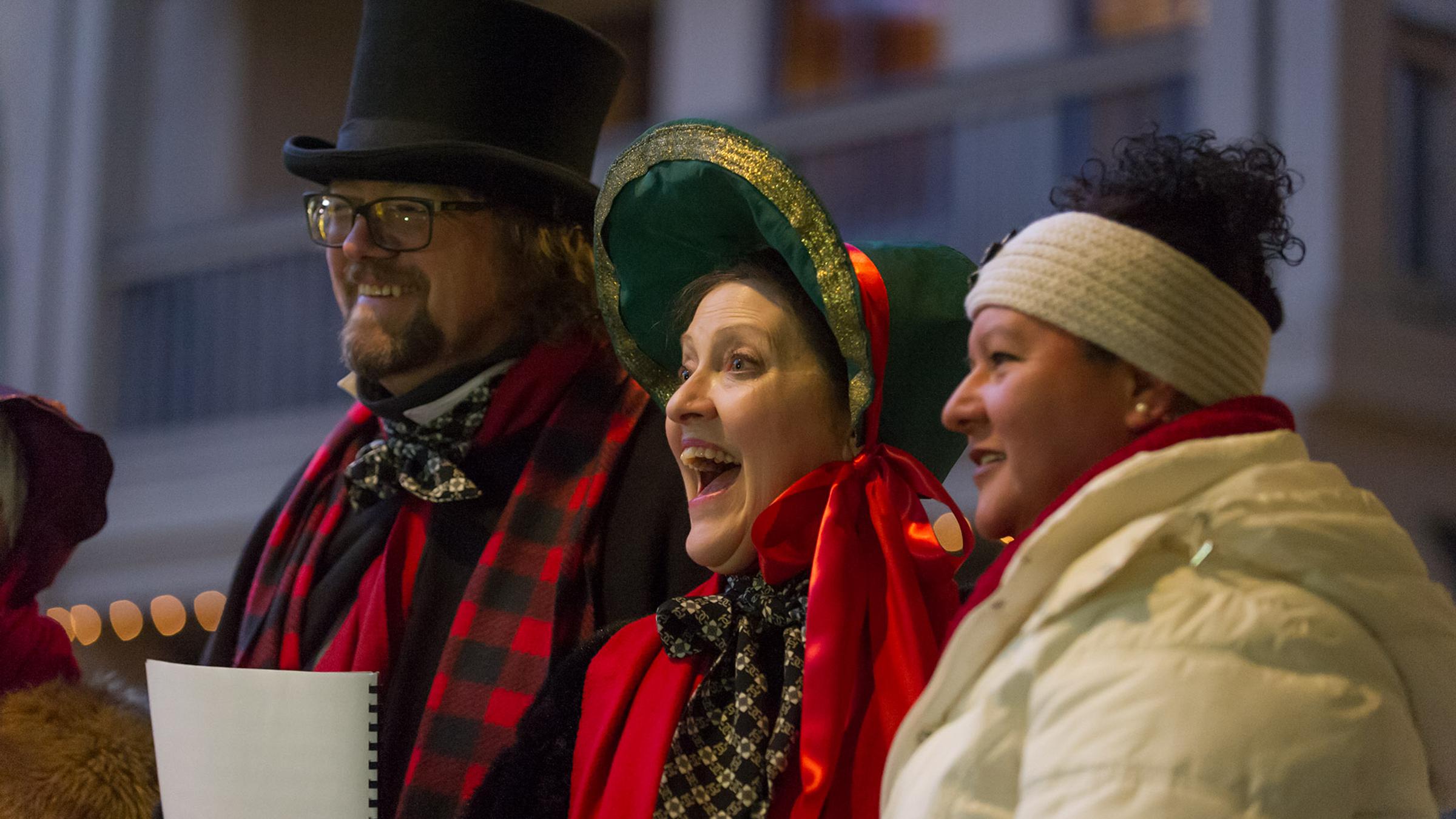 Three of the members of Great Basin Carolers sing in the Village at Palisades Tahoe
