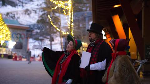 Three members of Great Basin Carolers sing in the Village at Palisades Tahoe