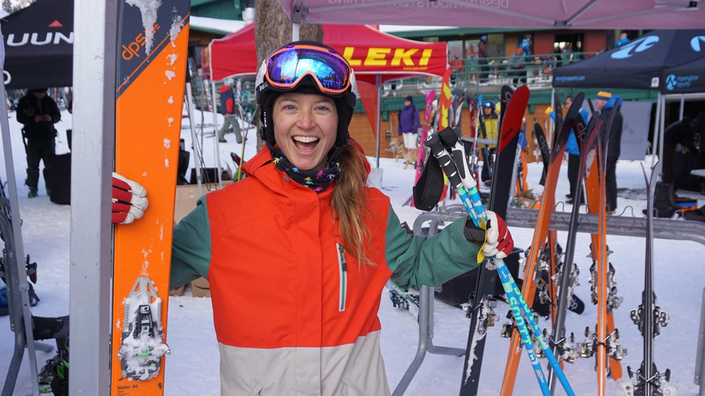 A woman picks skis at Alpenglow's annual Backcountry Demo Day event