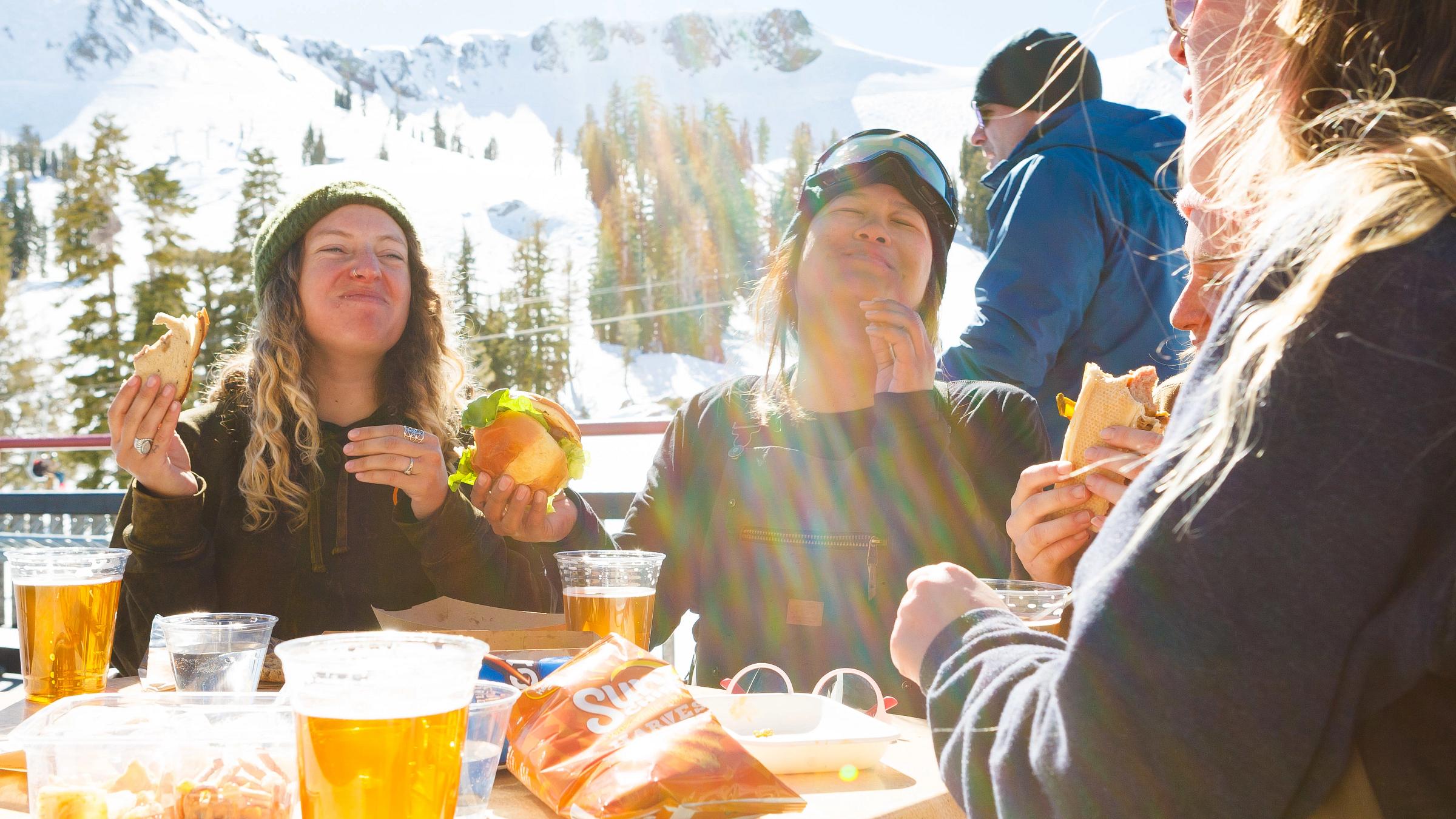 Women aprés at arc bar & gold coast deck, Group of women enjoying drinks outside The Arc at Squaw Valley's Gold Coast On-Mountain Lodge