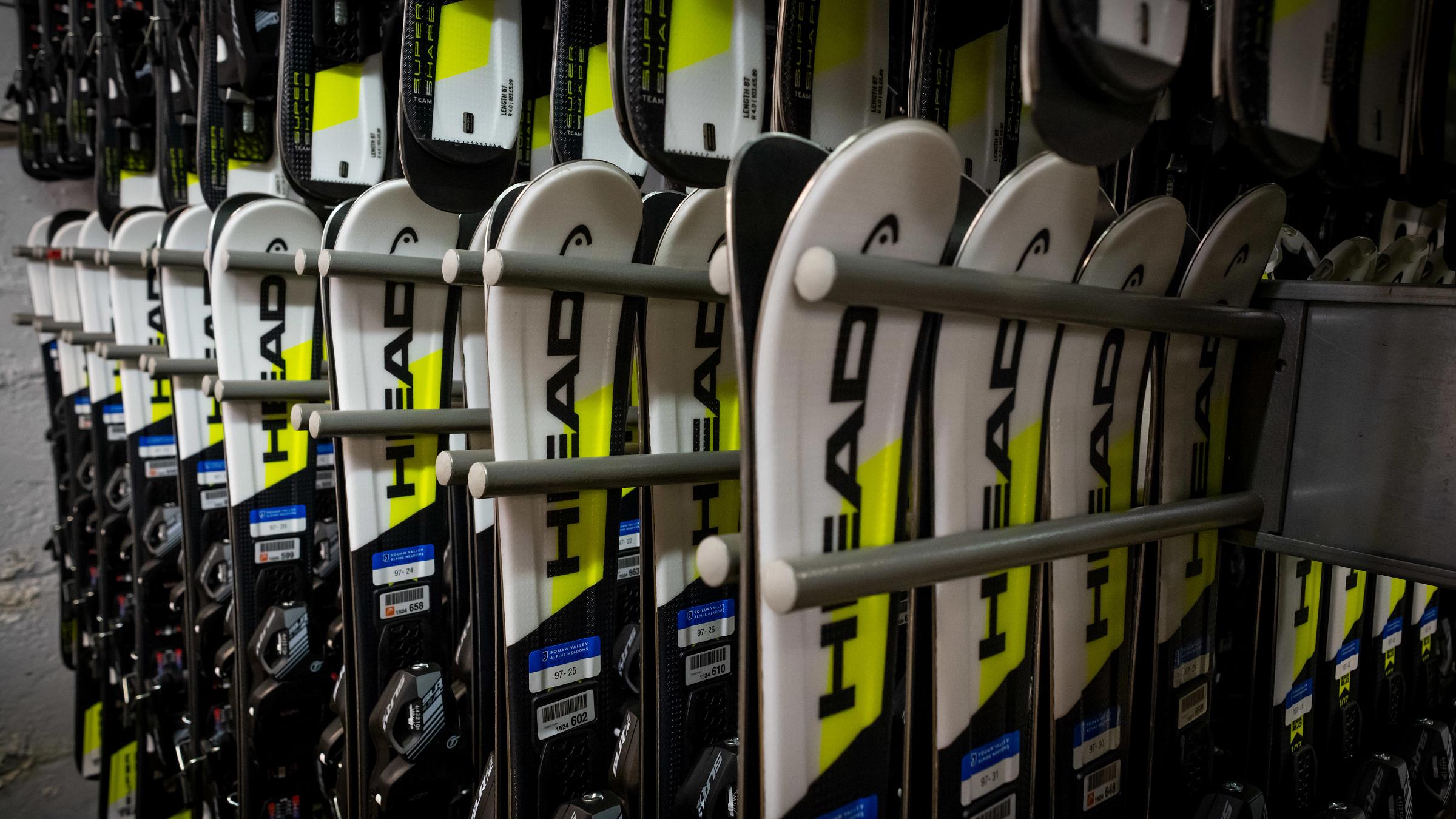Kids demo skis on the rack at the Demo & Rental Shop