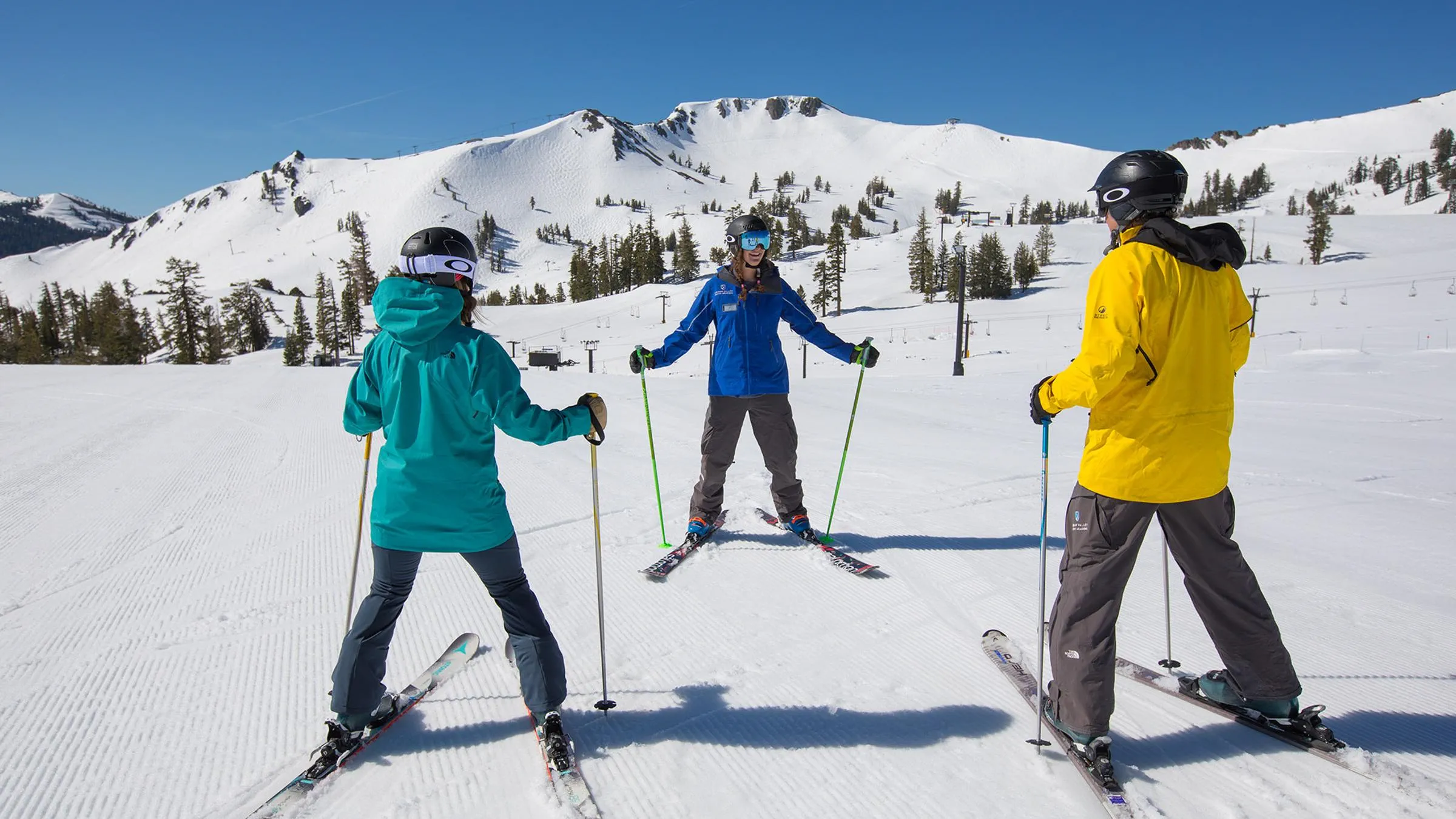 A group interaction on snow during Beginner Ski School photo shoot at Squaw Valley