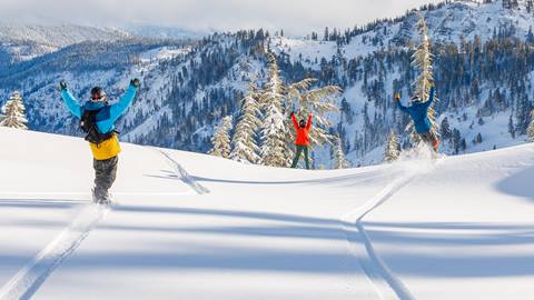 Friends snowboarding powder at Alpine Meadows