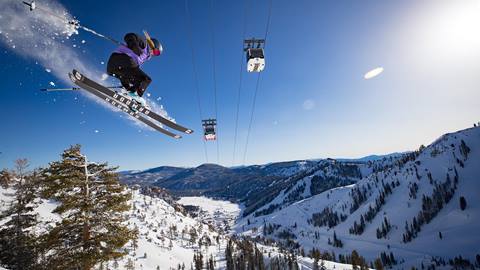 Epic air under the funitel by a female skier on broken arrow at Squaw Valley